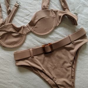 She In beige bathing suit high waisted